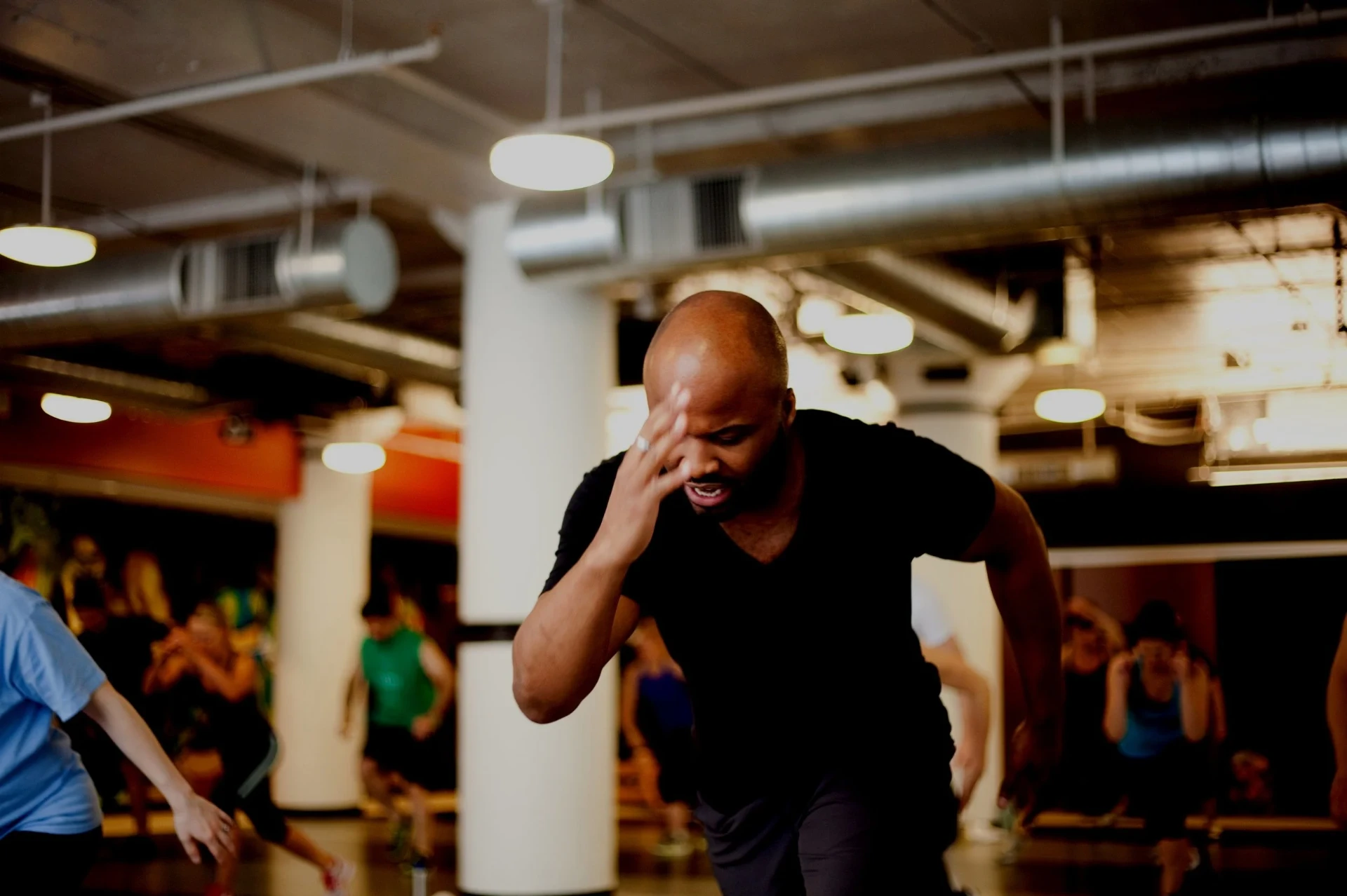 Tony Moses training in a dark industrial gym